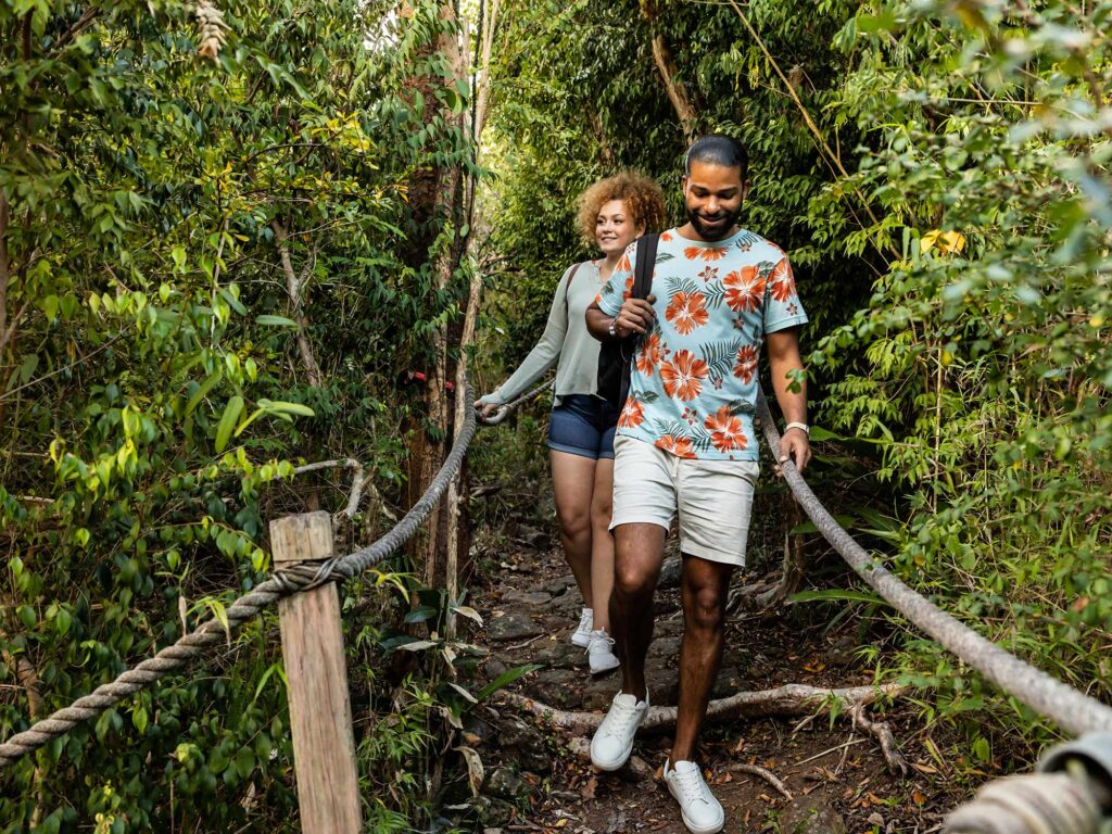 Couple crossing a bridge