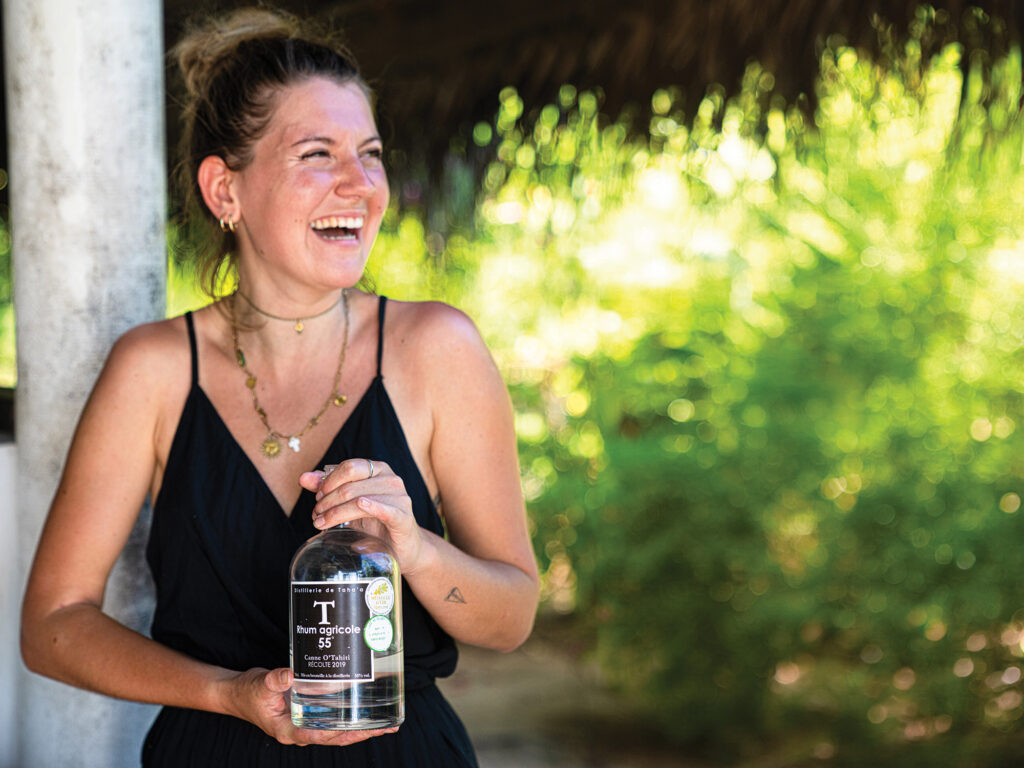 Woman holding rum bottle