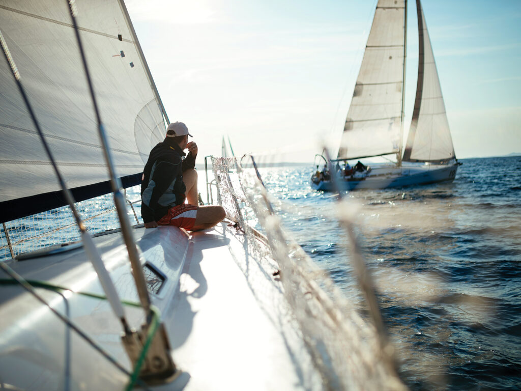 man relaxing on his sport sailboat