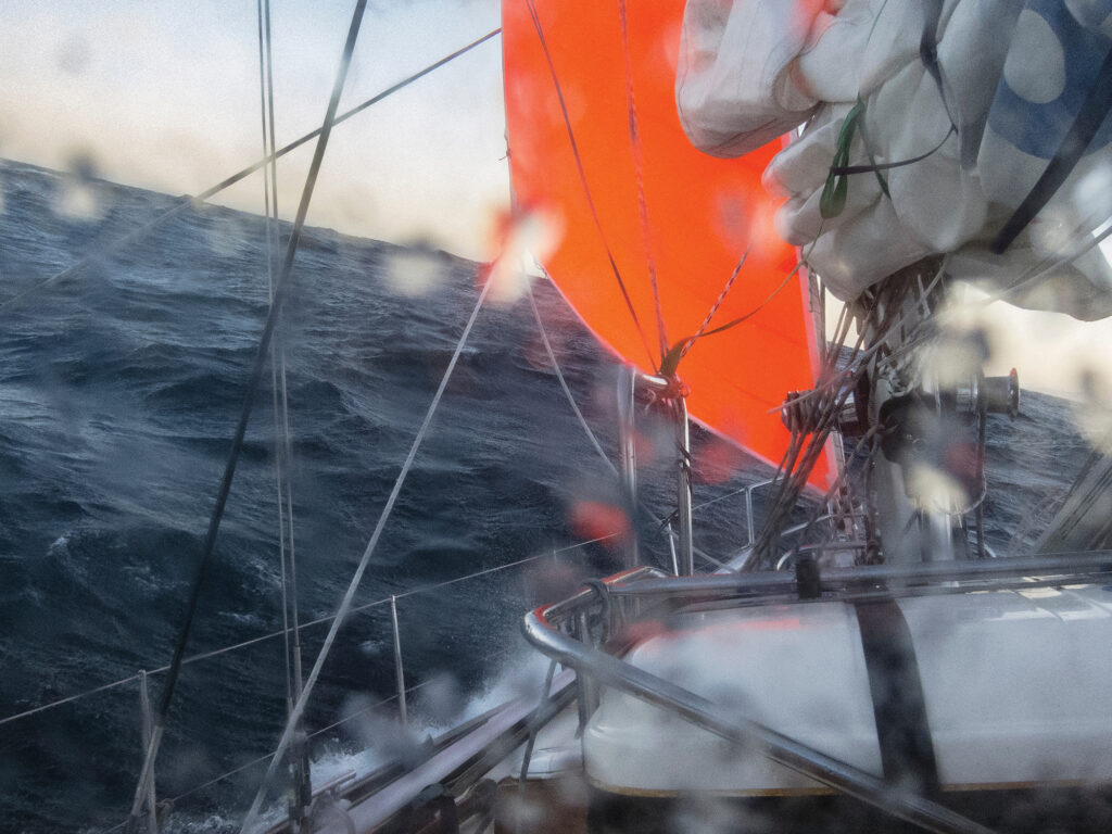 sailing yacht in heavy weather with storm and rain