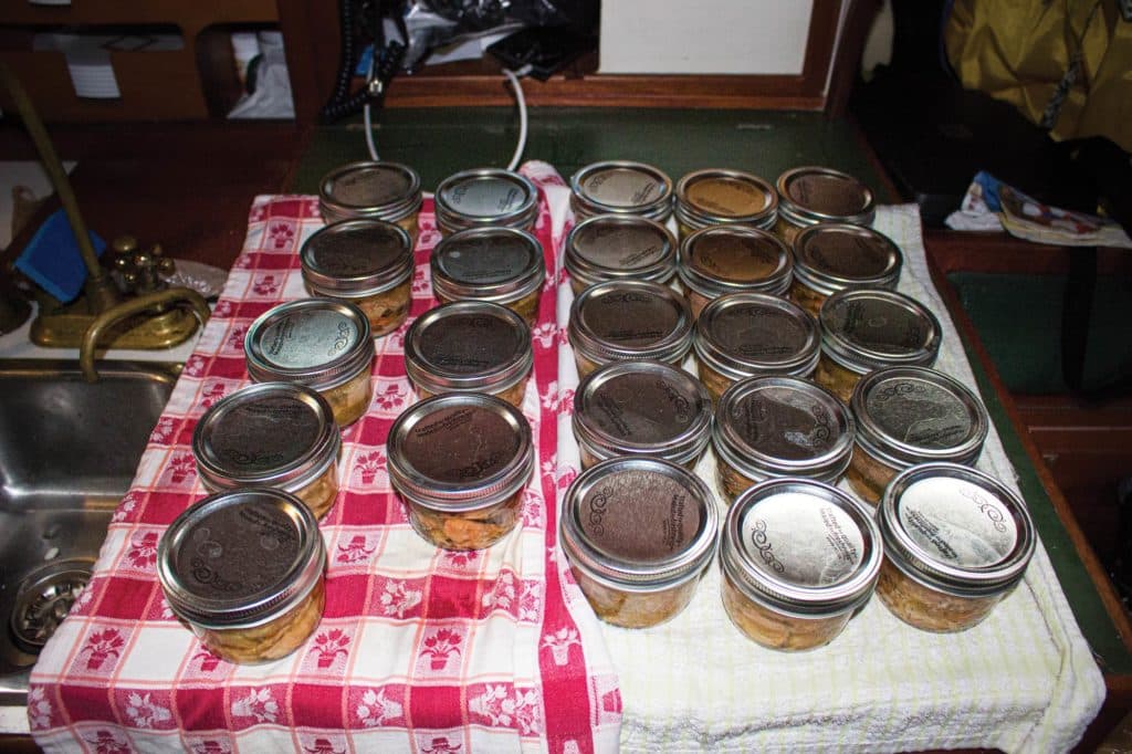 Canning fish aboard a boat.