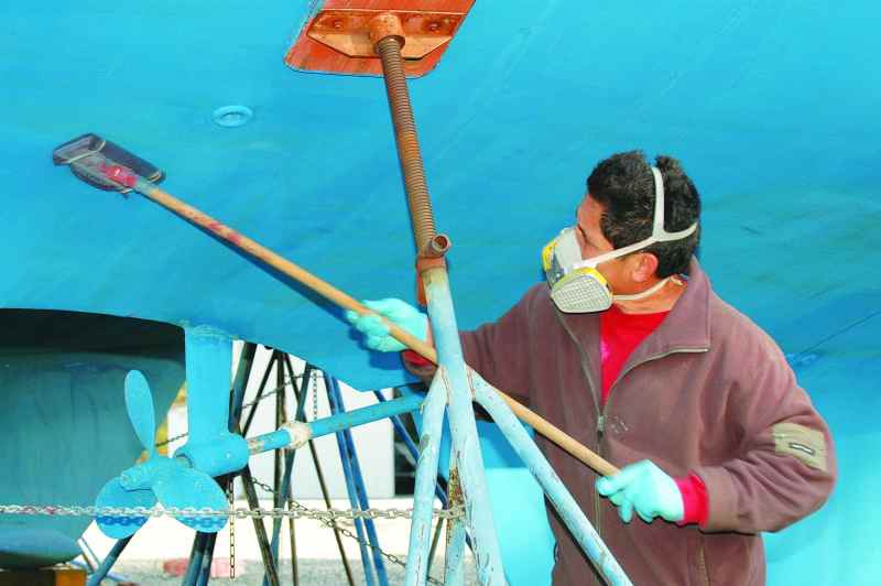 Sanding existing bottom paint improves the adhesion of additional coats, creating a mechanical bond.