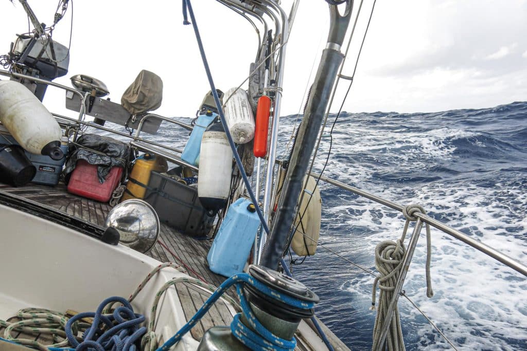 a boat tilting on its side on rough seas