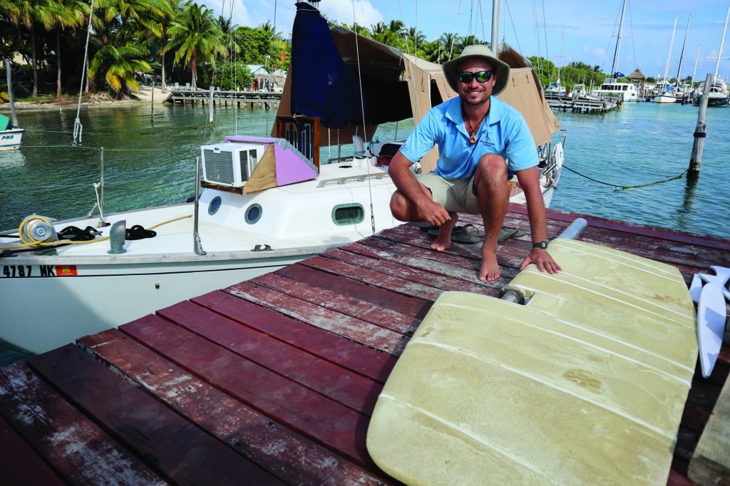 Jordan Wicht with a rudder he built