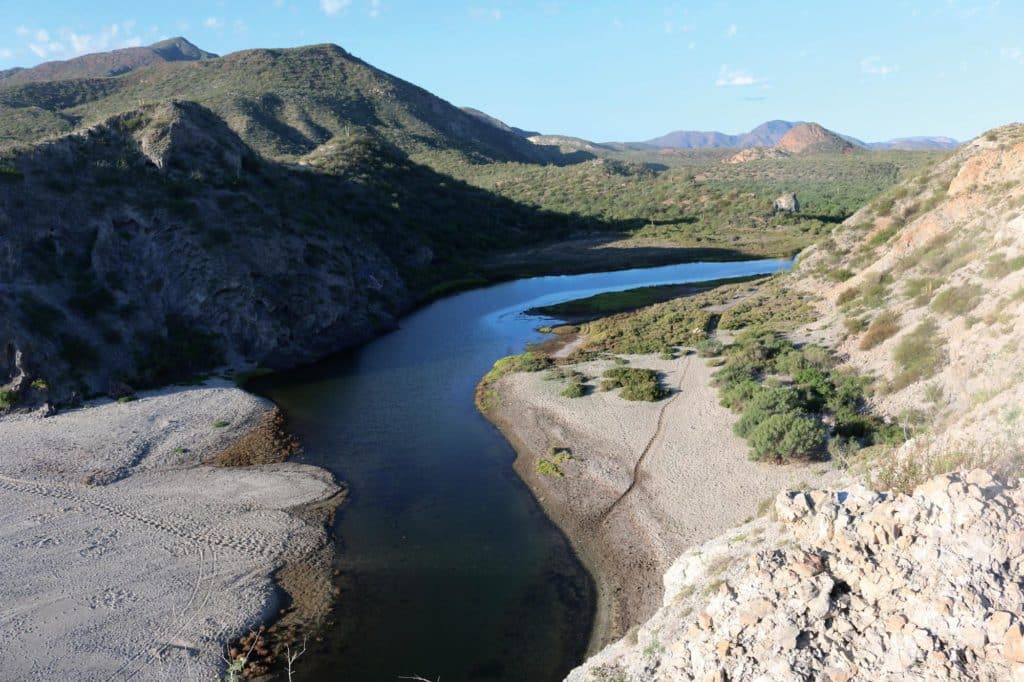 A river slicing through the desert at San Juanico