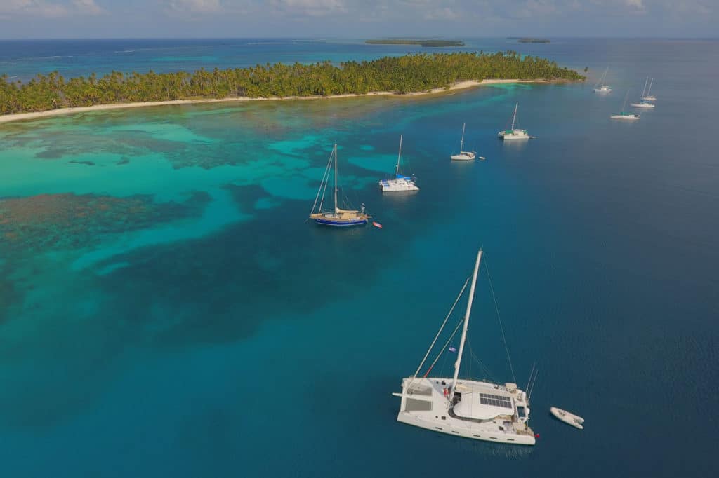 Boats anchored along a coastline