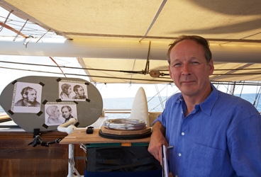 Michael FitzRoy Bearing a remarkable resemblance to his great-great grandfather—the skipper of the HMS Beagle, Lieutenant Robert FitzRoy of the Royal Navy— Michael FitzRoy poses with sketches of his famous ancestor in the middle of the Atlantic Ocean.