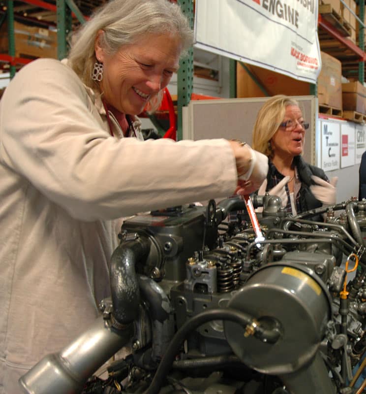 Loosening fuel injector lines Lauralyn loosens the fuel injector lines so the engine won't inadvertently start.
