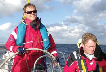 Sailing offshore in trade-wind swells, this watch team felt more comfortable decked out in their foulies and safety gear.