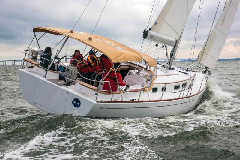 Contributing to the secure feeling of the Moody Aft Cockpit 41 under sail are the wide, uncluttered side decks and the coamings that wrap around the back of the cockpit, behind the twin wheels.