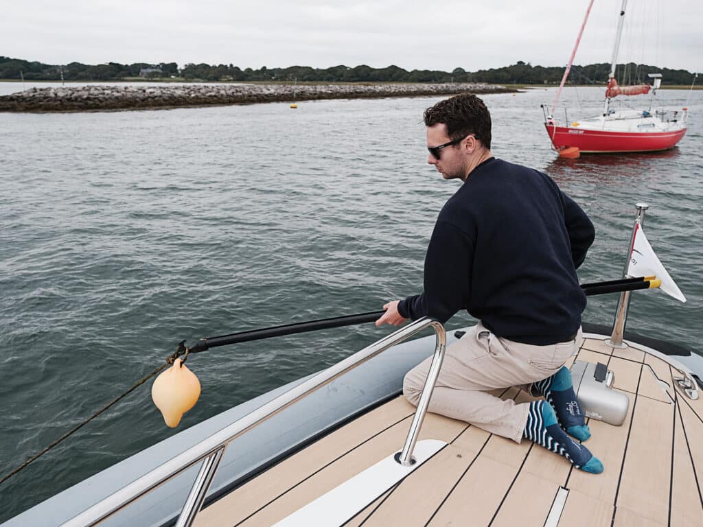 Man using boat hook