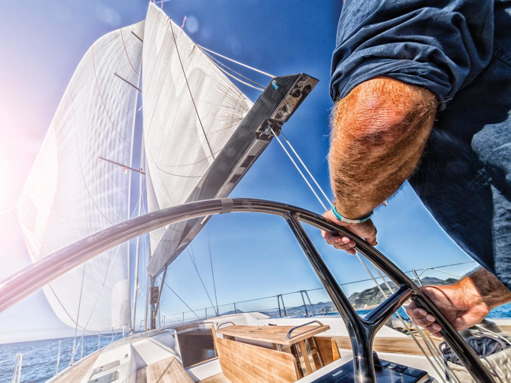 man driving sailing boat in navigation