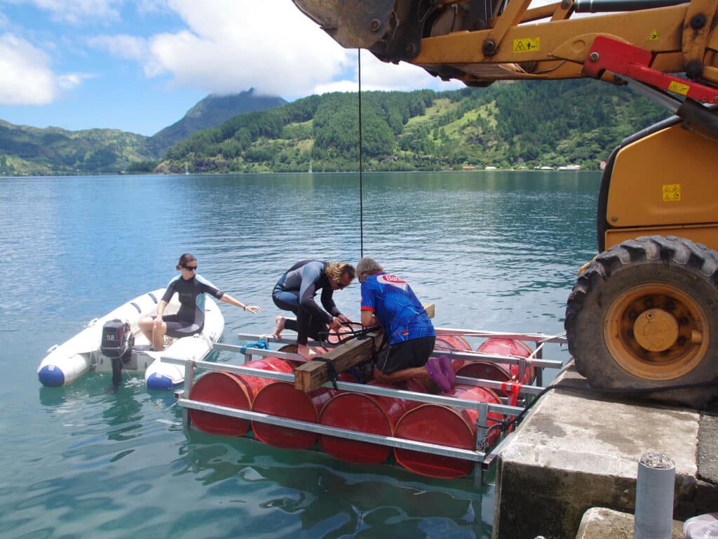 Positioning the raft over the heavy new mooring block.