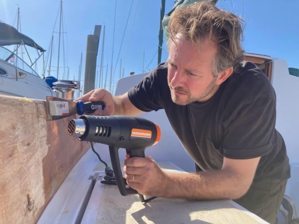 Drying varnish on the side of a sailboat