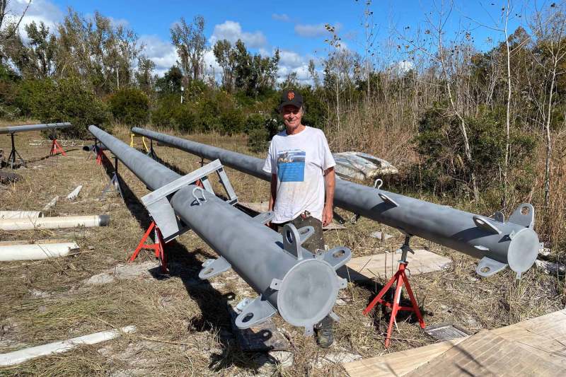 steel masts lay on the ground
